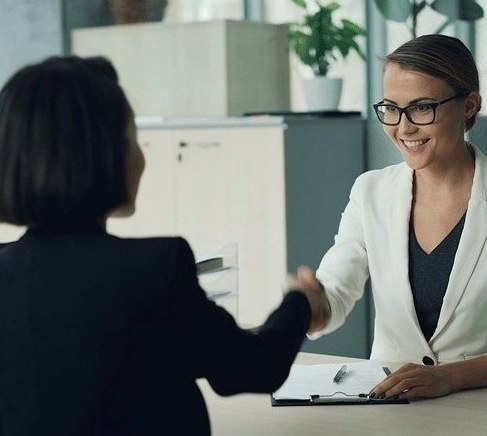 A mentoring one-on-one moment between two Scadea teammates