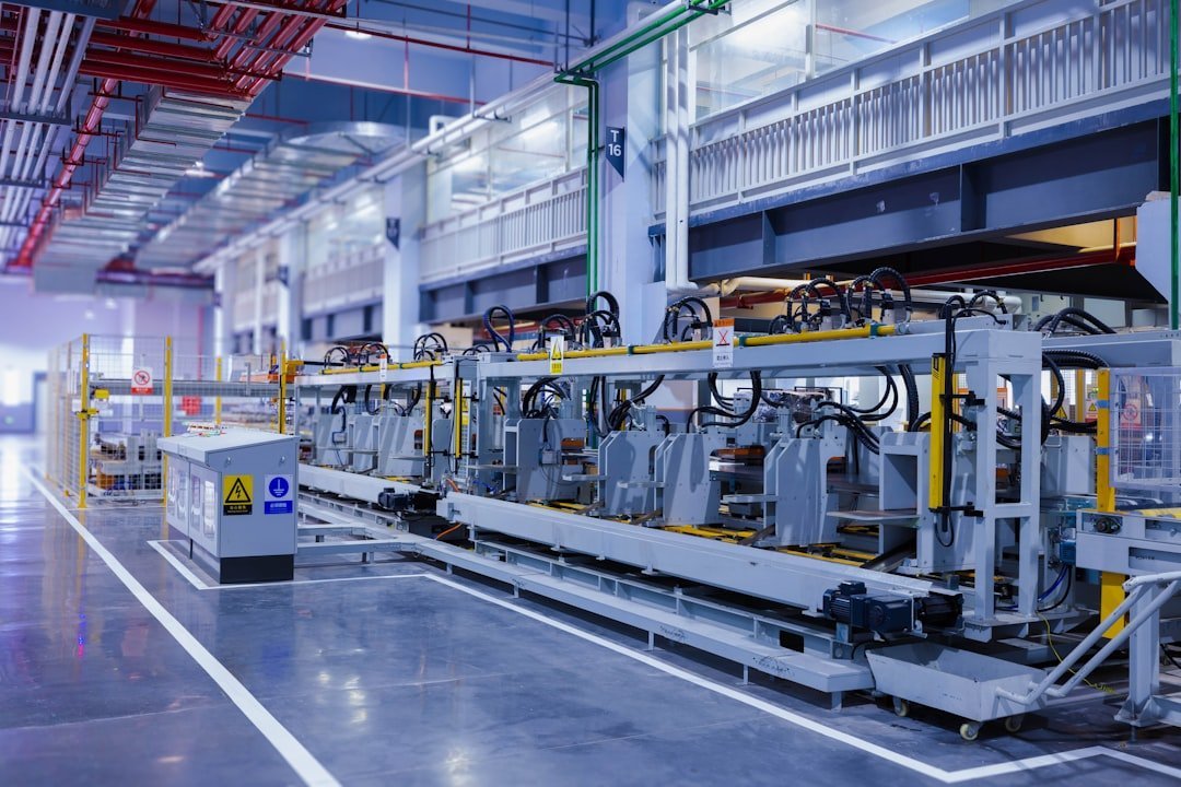 Automated production line on a modern blue-toned factory floor