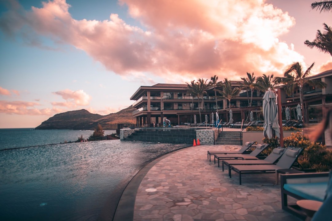 Luxury resort pool and villas at dusk