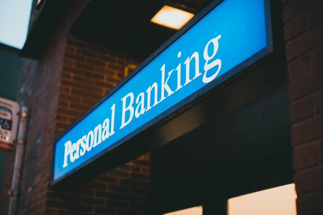 Illuminated Personal Banking sign outside a bank branch