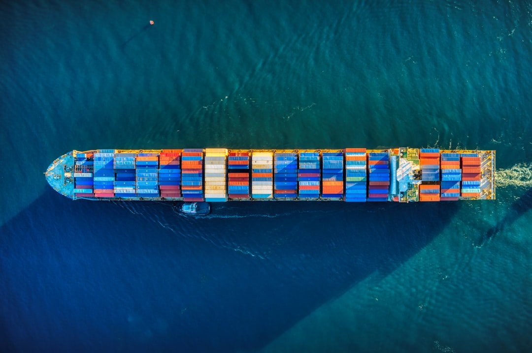 Aerial view of a container ship carrying cargo across open water