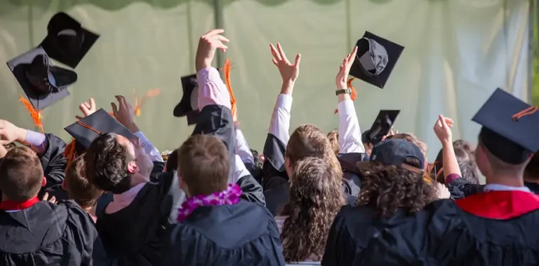 Graduates throwing caps in the air in celebration.