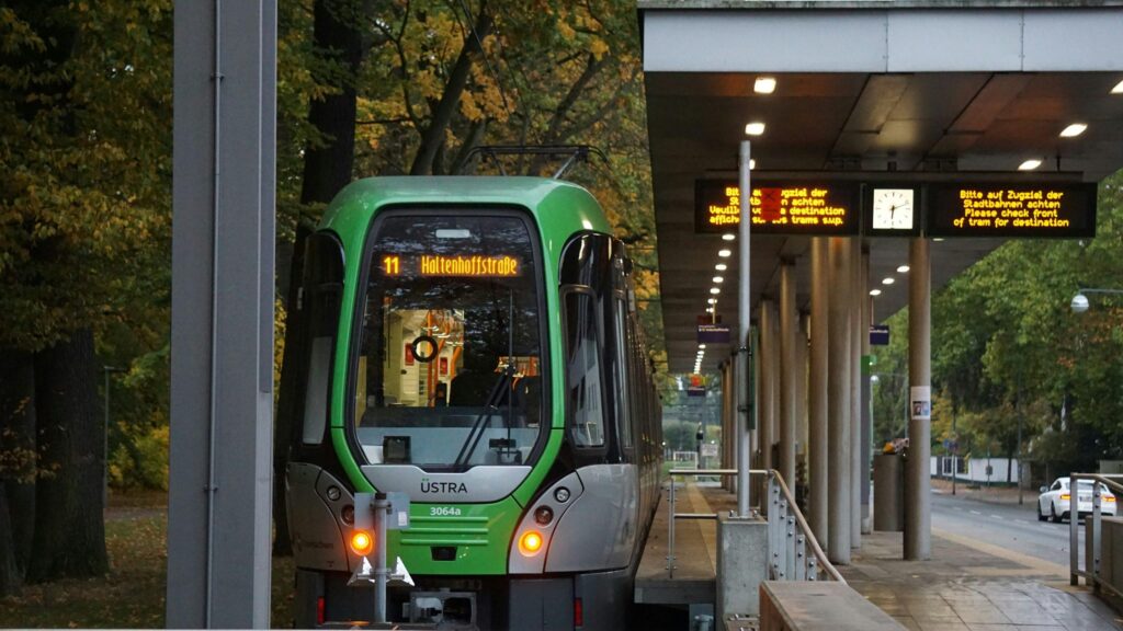 ÜSTRA tram 11 at Haltenhoffstraße station platform.