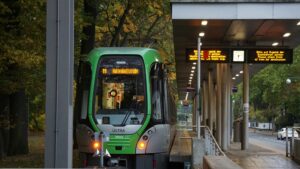 ÜSTRA tram 11 at Haltenhoffstraße station platform.