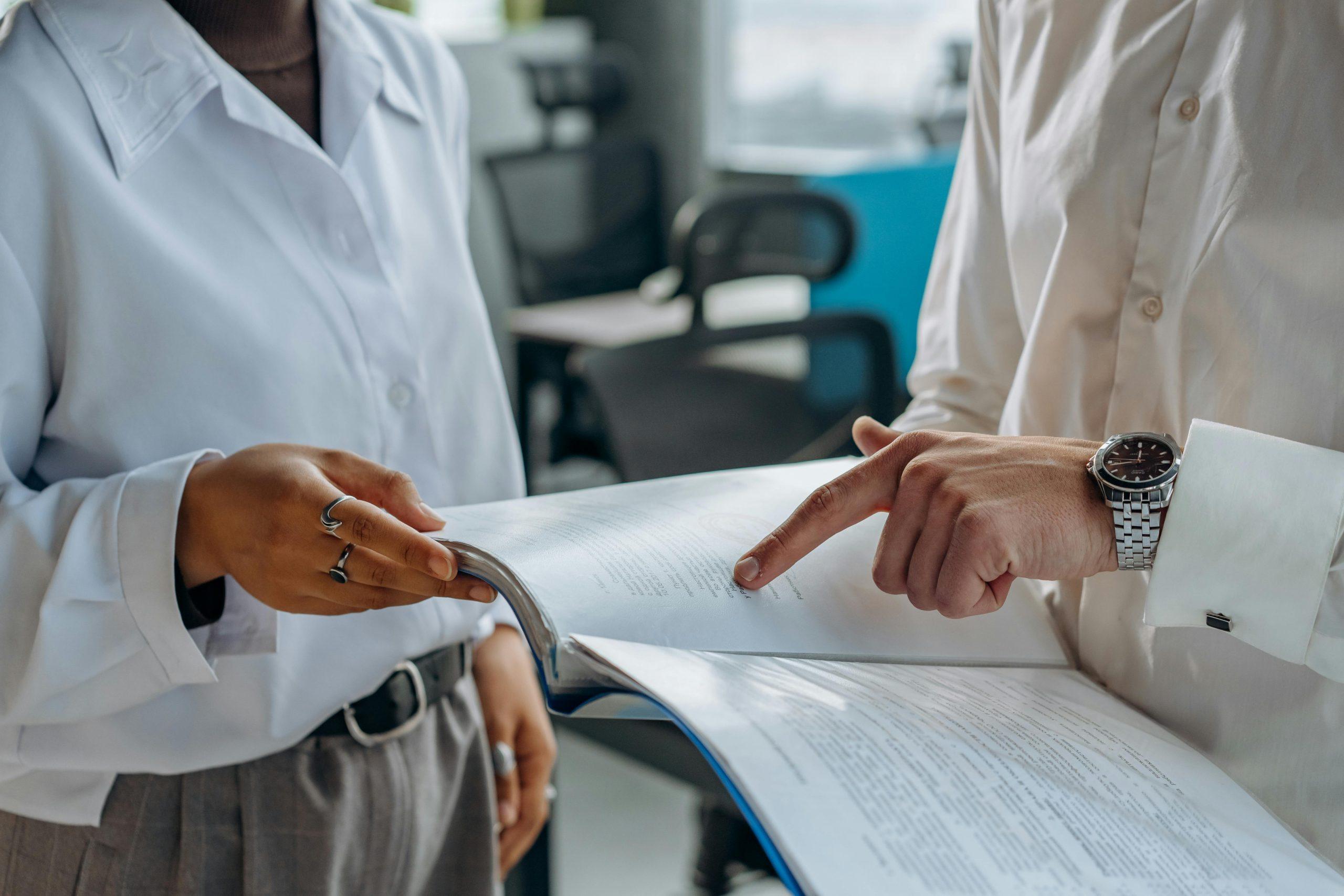 Two people reviewing a document.