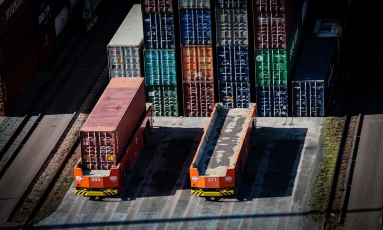 Stacked shipping containers and container chassis at an intermodal freight terminal