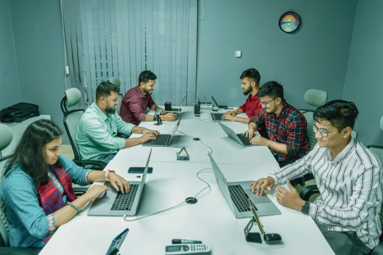 Professionals collaborating on managing augmented developers