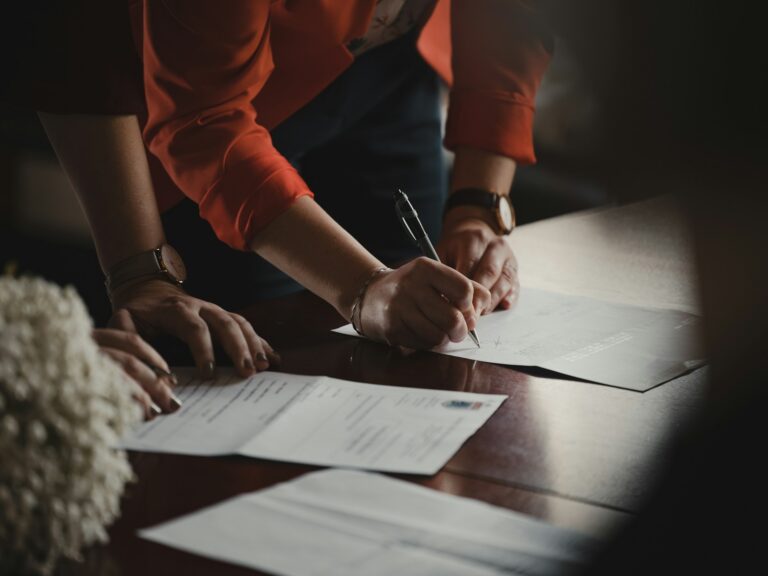 Professionals collaborating on staff augmentation legal compliance