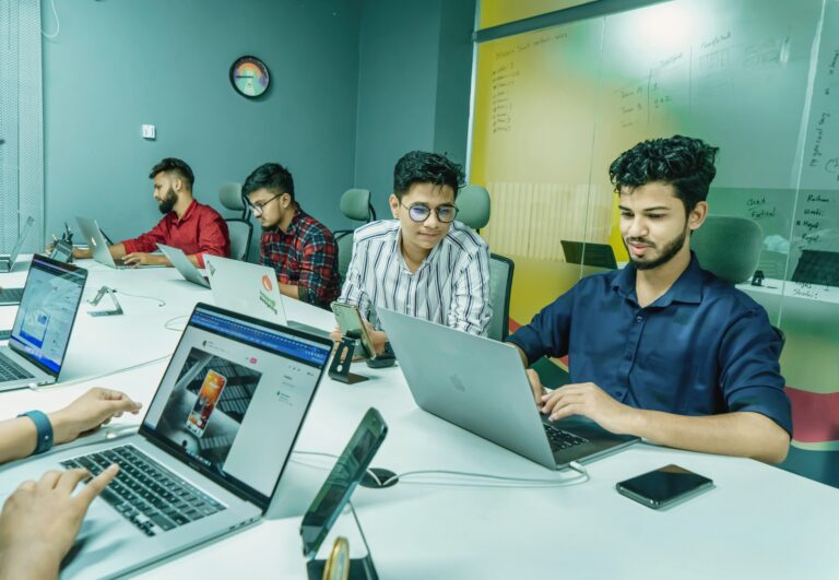 Professionals collaborating on staff augmentation vs outsourcing
